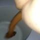 One of our users records his large wife taking a sloppy, wet shit into a plastic bucket while sitting on a porta-potty type chair. Finished product shown in bucket.